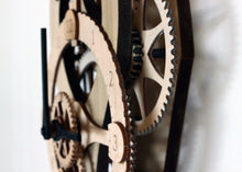 Load image into Gallery viewer, Side view of head of clock. Shows gear thickness. Mounted on wall