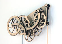 Load image into Gallery viewer, 1/4 view of clock head hung on a white wall.